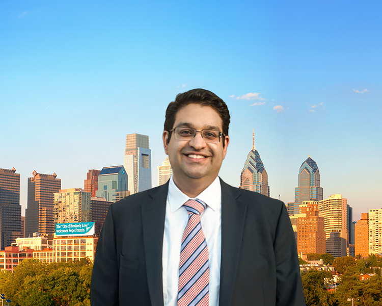 Cyrus Shaw with the Philadelphia skyline in the background